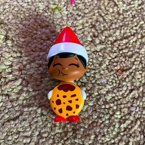 A little toy elf on the shelf